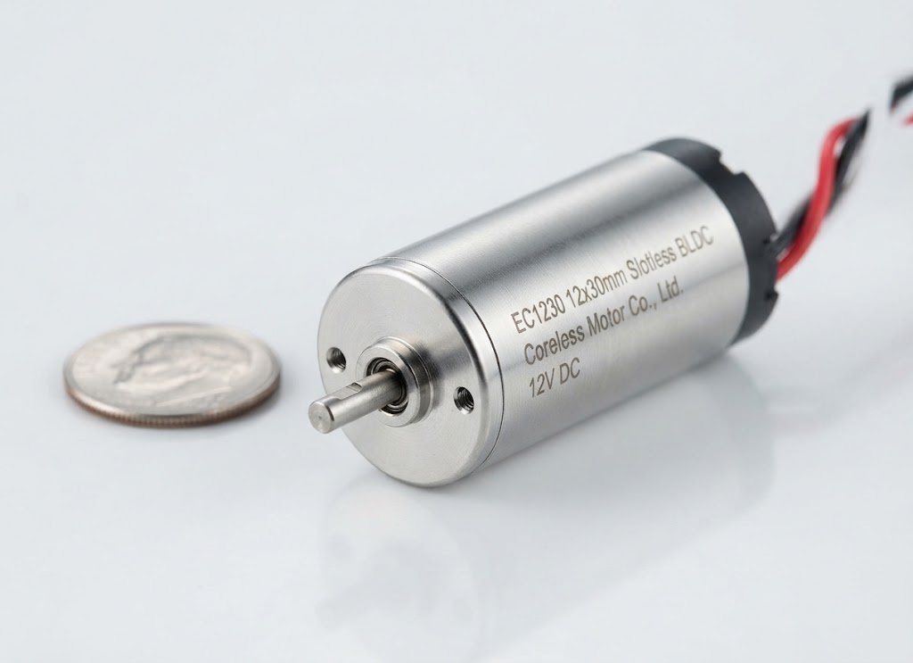 EC1230 12x30mm slotless brushless DC motor with integrated lead wires shown next to a coin for scale