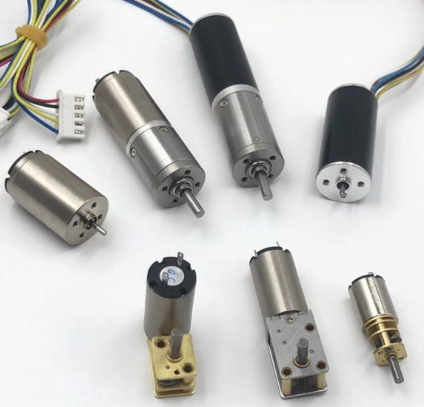 Exploded diagram of a coreless DC motor showing self-supporting copper coil, NdFeB magnet, and stainless steel shaft